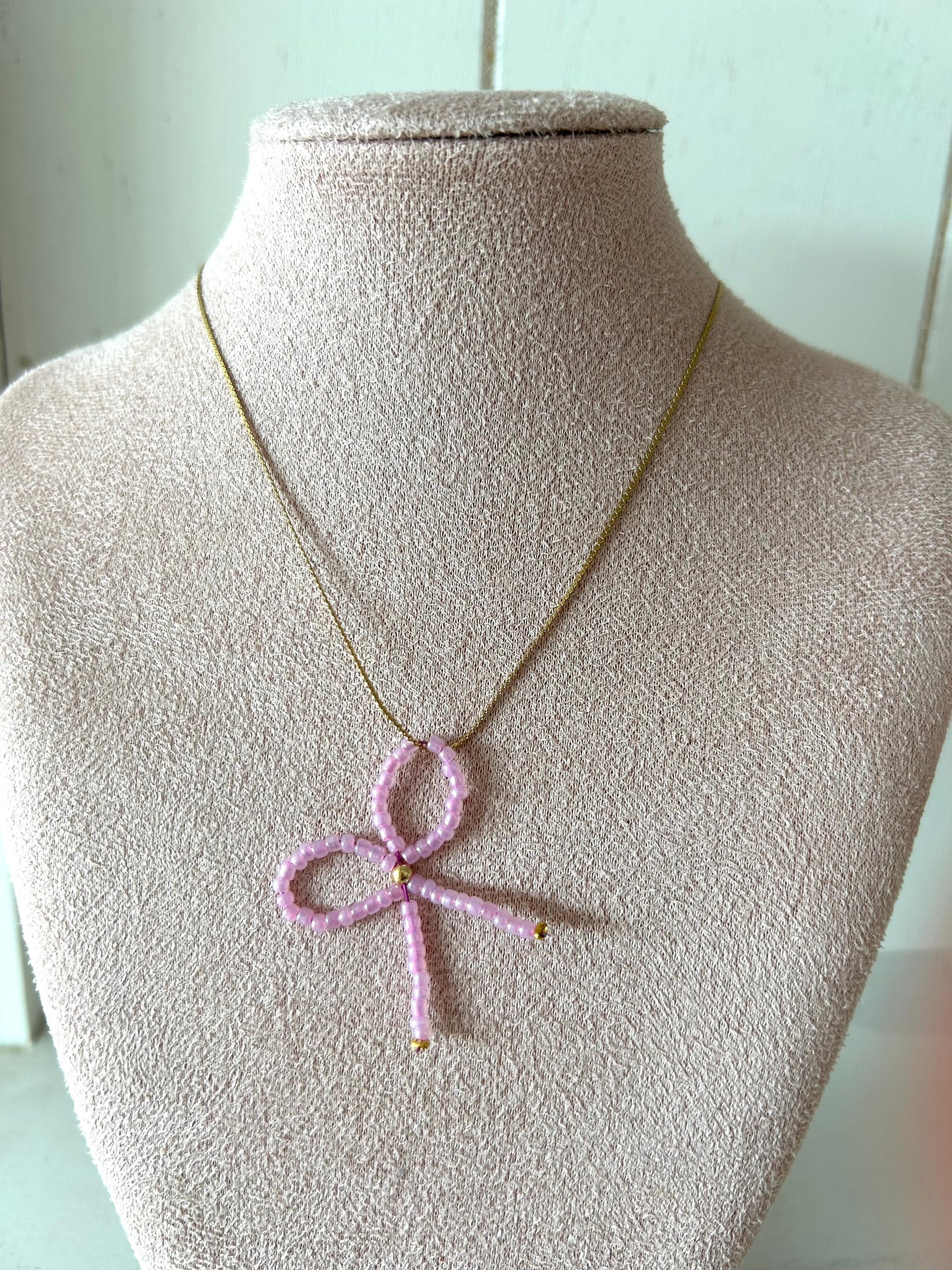 Ketting met roze strikje - goud