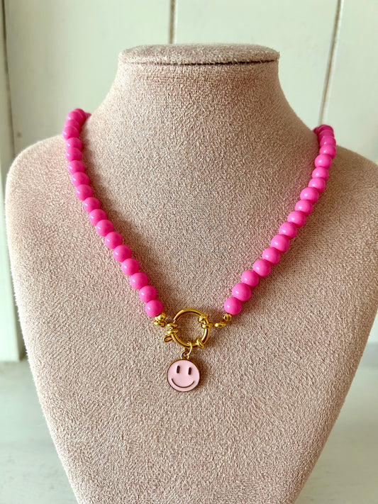 Kralenketting met smiley fuchsiaroze - goud