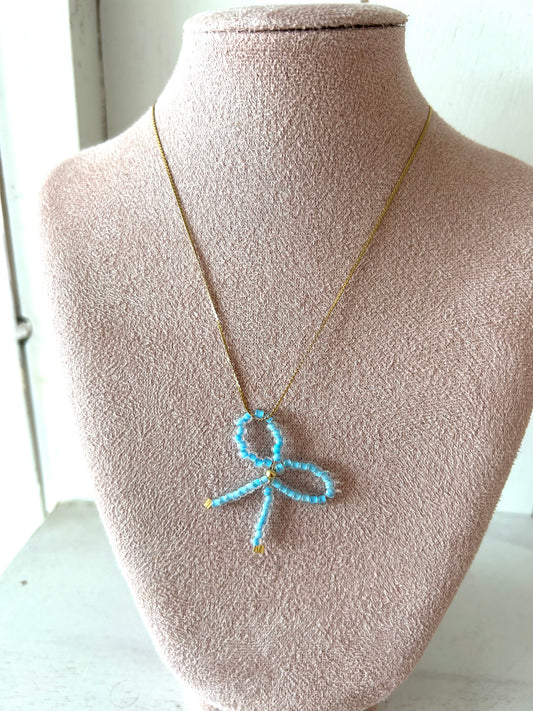 Ketting met neon blauw strikje - goud