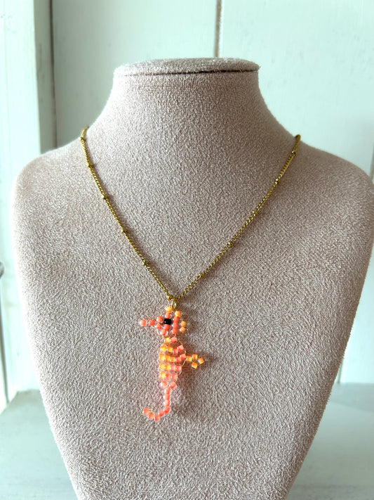 Ketting met neon oranje zeepaardje - goud